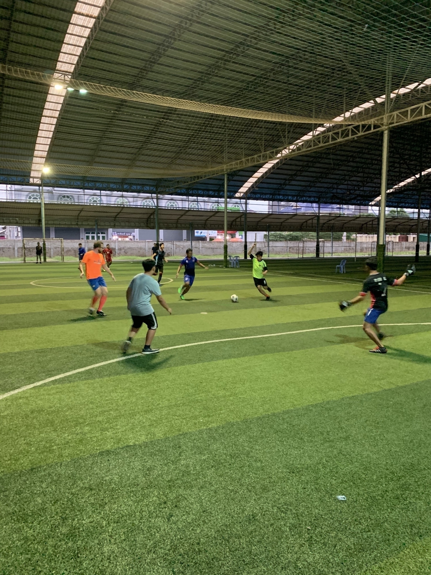 Six-a-side soccer game, under cover and under lights